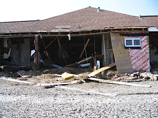 House missing front wall and interior gutted out